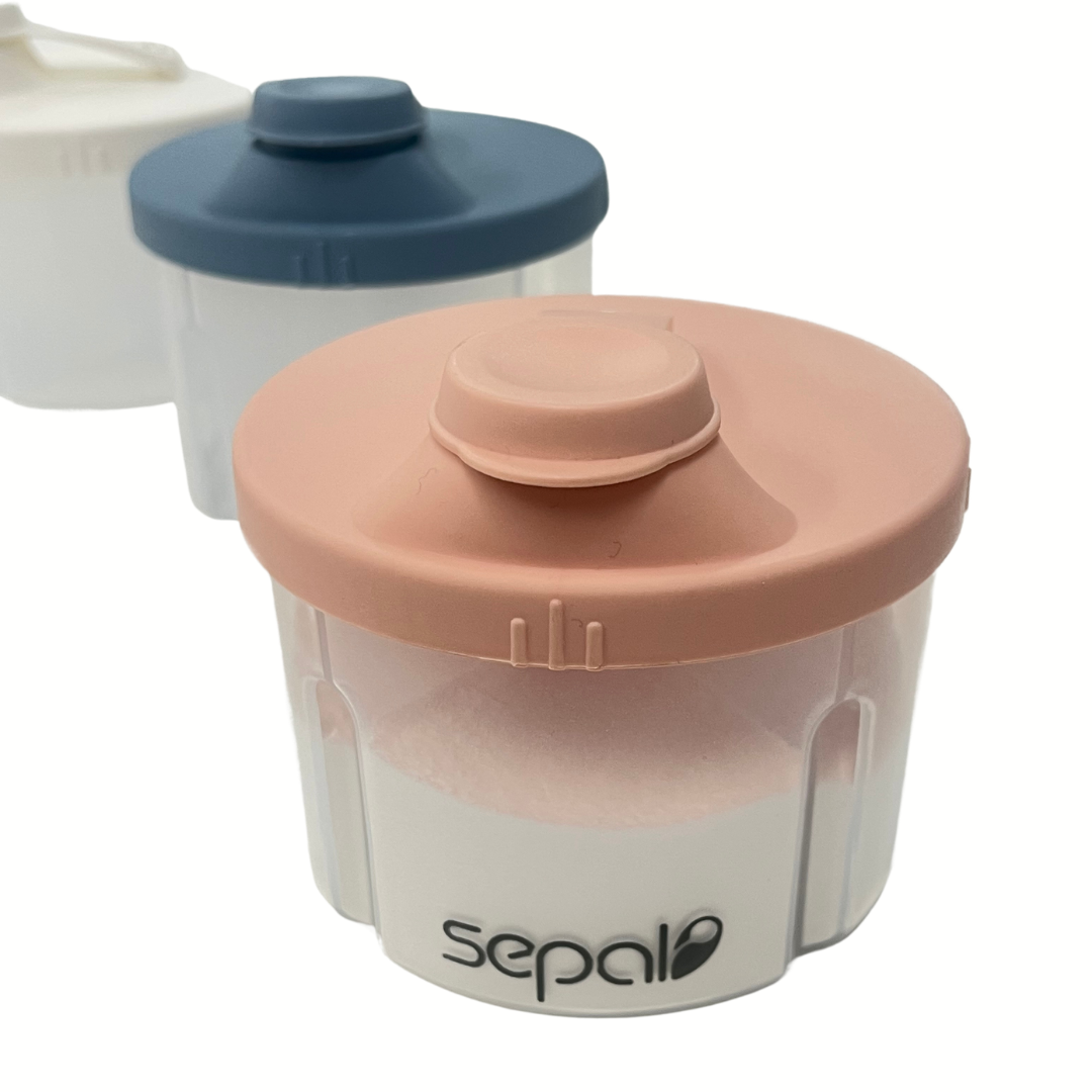 Two baby formula containers with lids on a white background, featuring the brand 'sepal'.