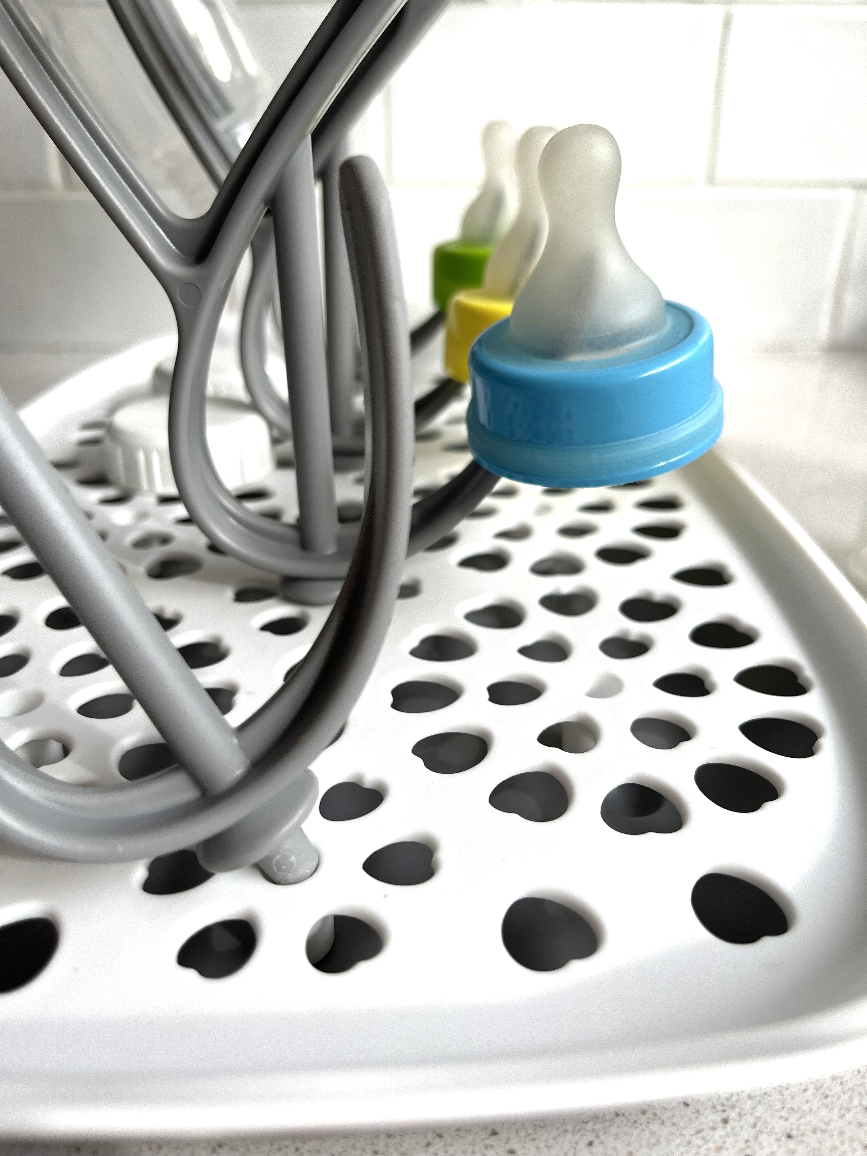 3 different Sepal teats and some Sepal white caps on the Sepal bottle & teat drying rack.