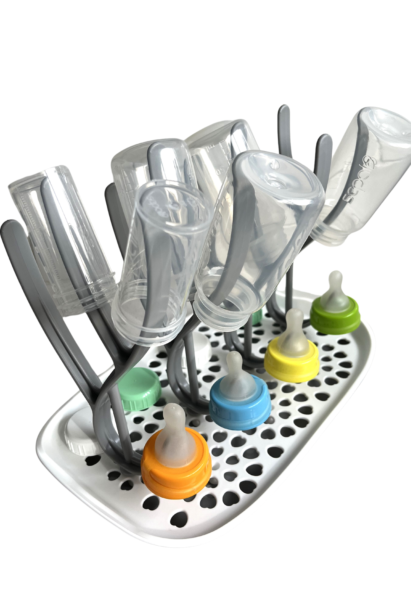 An assortment of Sepal bottles, teats, caps & teat covers on the Sepal bottle & drying rack.