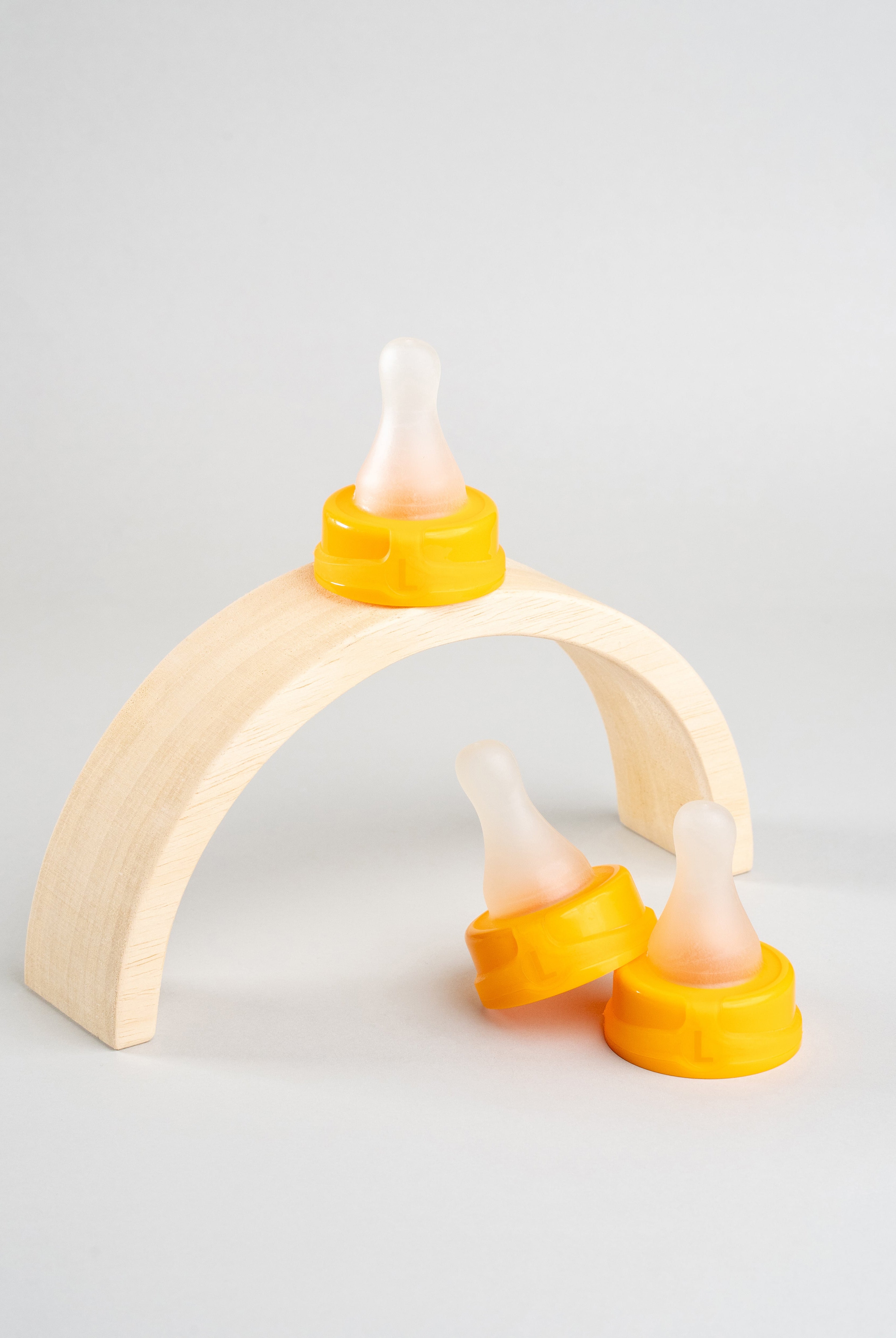 3 Sepal orange large teat fast flow. Displayed on a wooden arch.