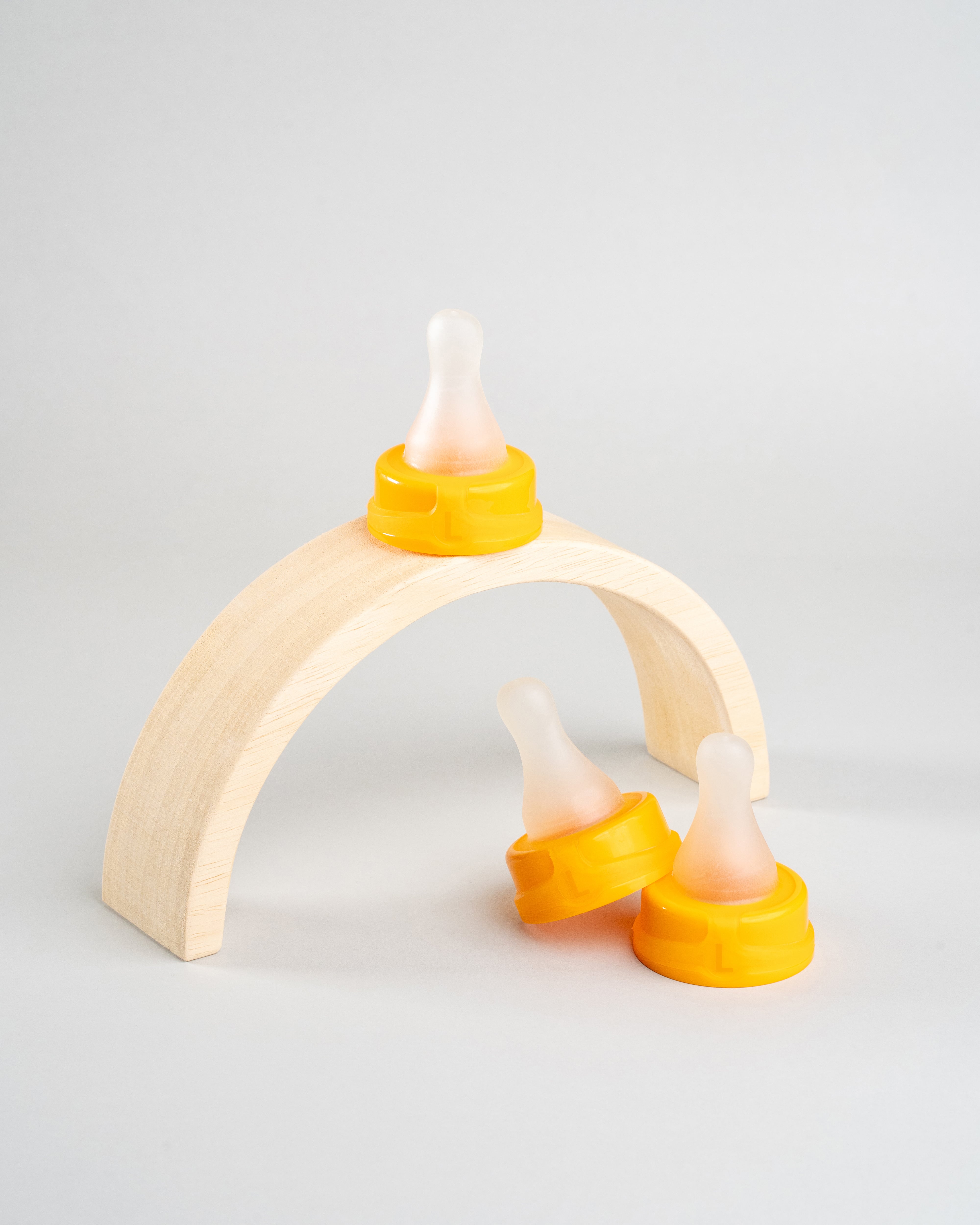 3 Sepal orange large teat fast flow. Displayed on a wooden arch.