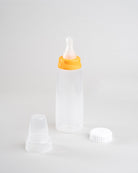 250ml Sepal baby bottle with orange large teat fast flow attached. Beside the bottle is a Sepal white cap and a clear Sepal teat cover.