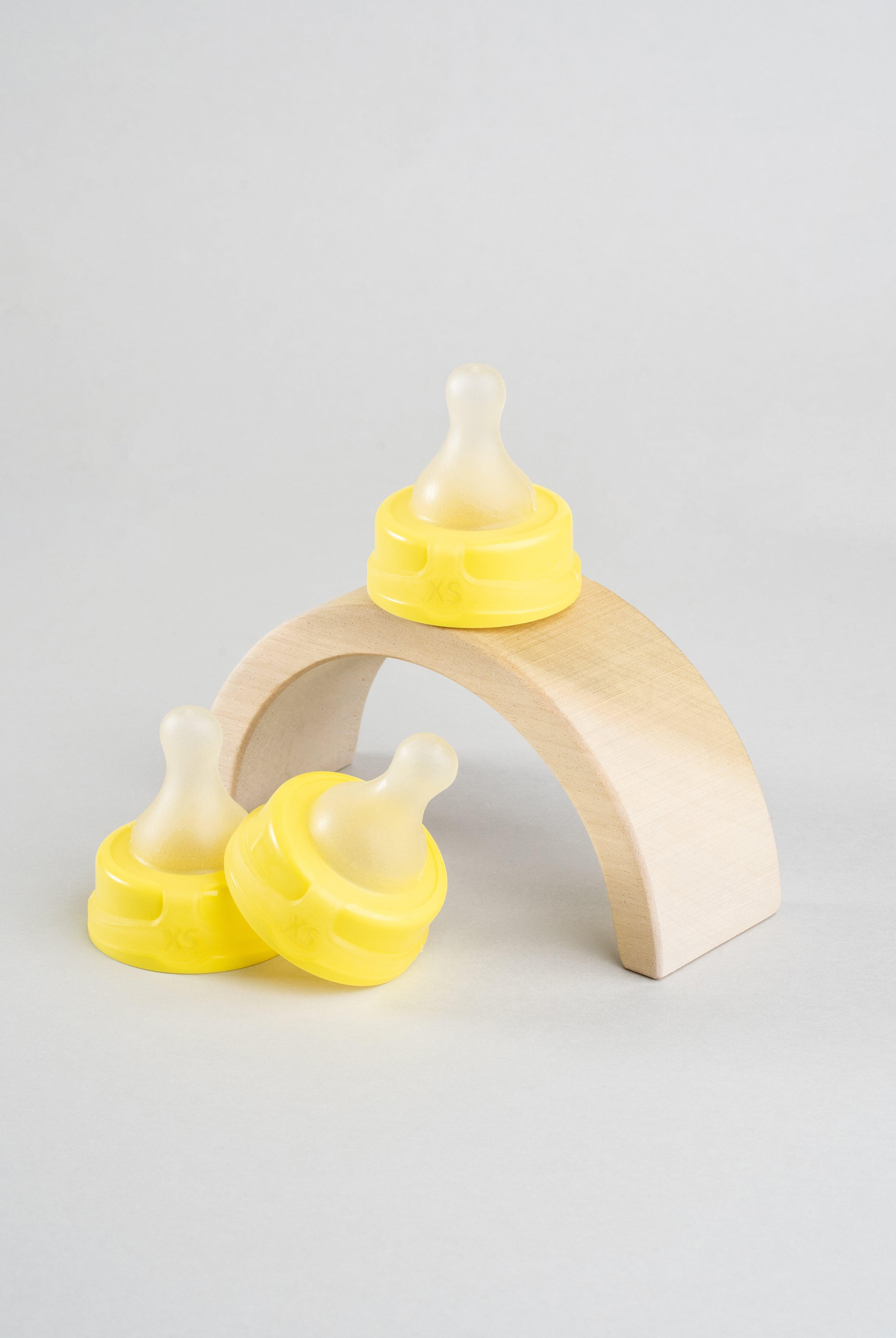 3 Sepal yellow extra small medium flow teats displayed on wooden arch.