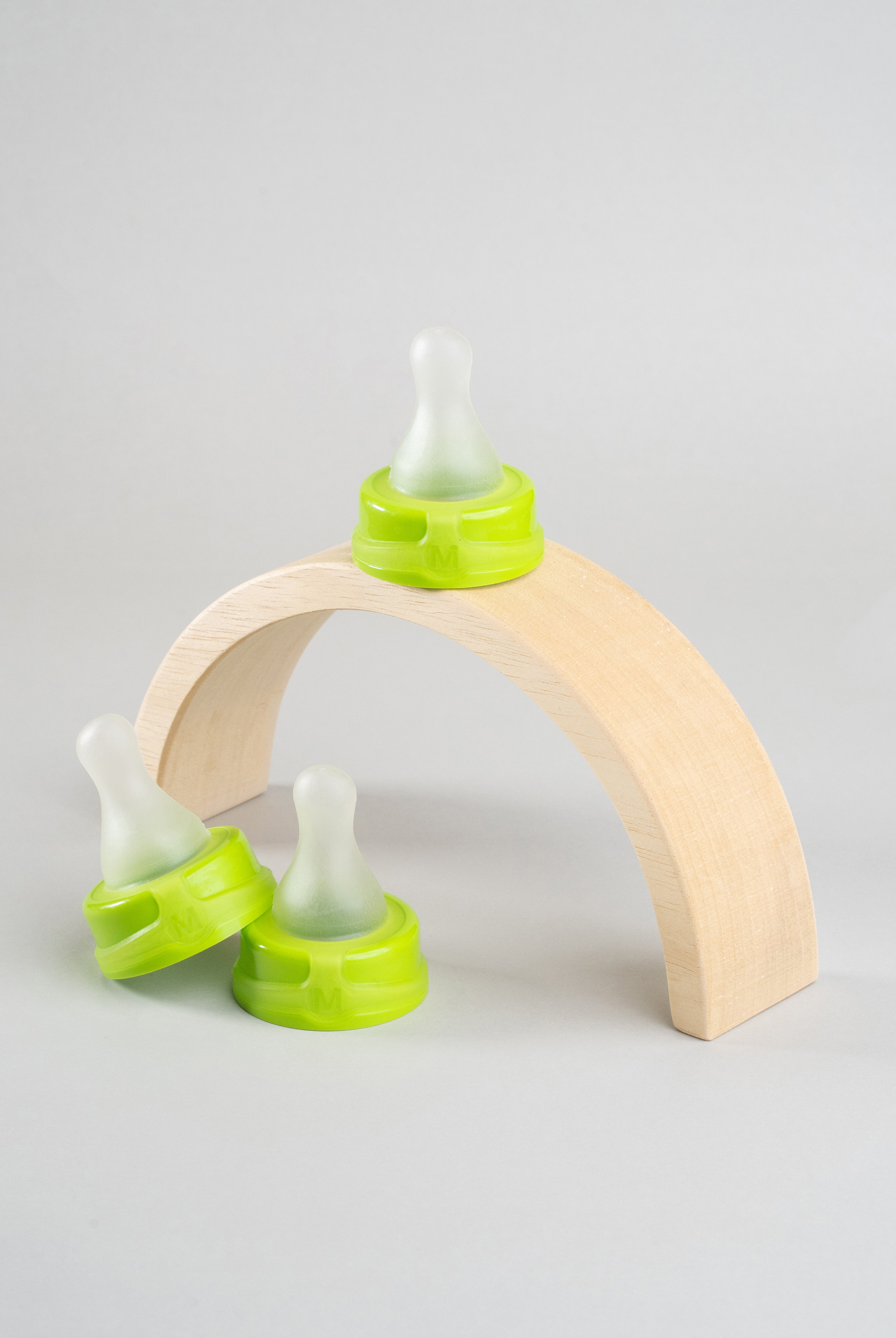 3 Sepal green medium teat slow flow displayed on wooden arch.