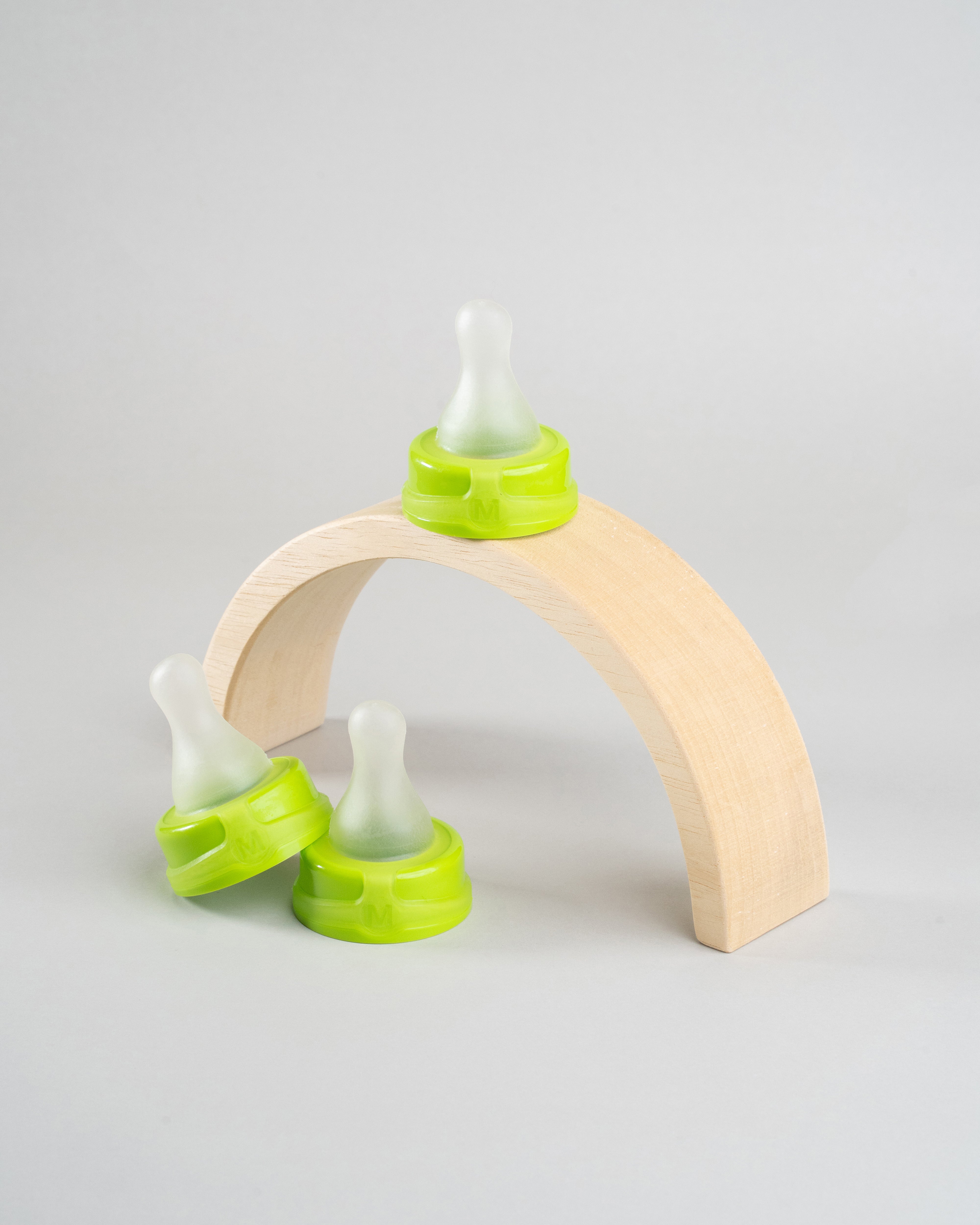 3 Sepal green medium teat slow flow displayed on wooden arch.