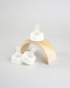 3 Sepal white extra small ultra slow flow teats. Displayed on a wooden arch.