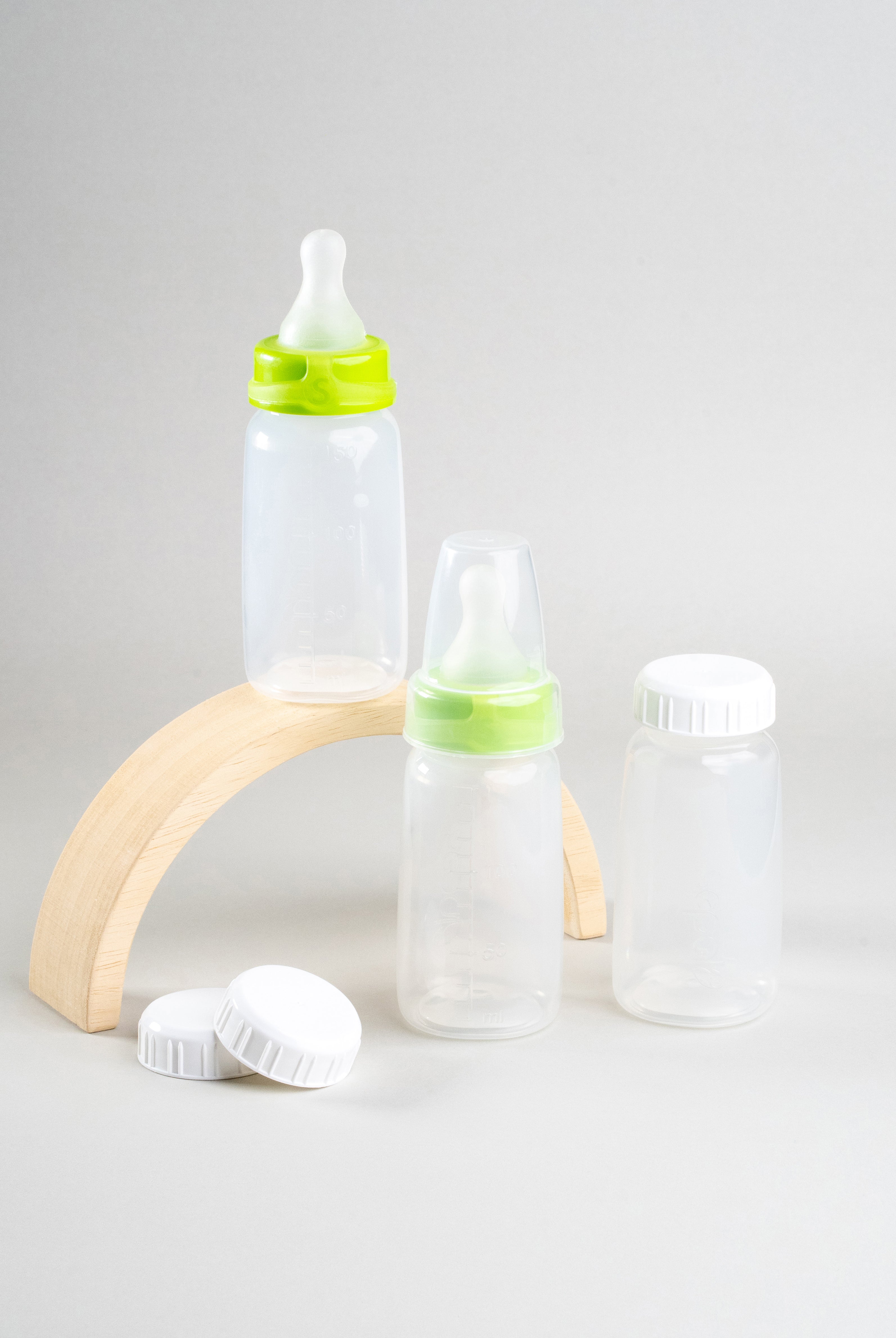 Display of 3 Sepal 150ml bottles, 2 green Sepal Small teat slow flow, 3 Sepal White caps and 1 Sepal clear teat cover.
