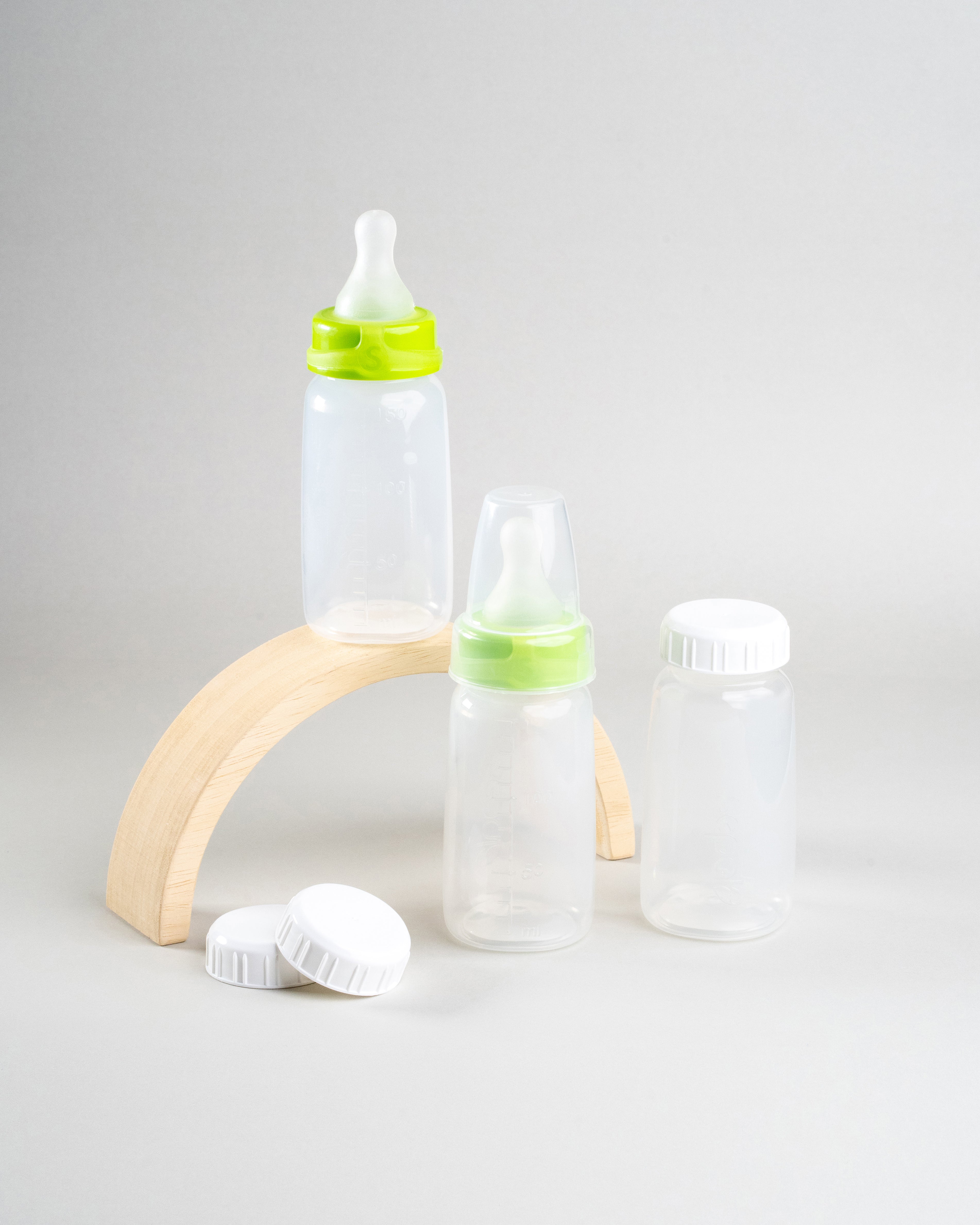 Display of 3 Sepal 150ml bottles, 2 green Sepal Small teat slow flow, 3 Sepal White caps and 1 Sepal clear teat cover.