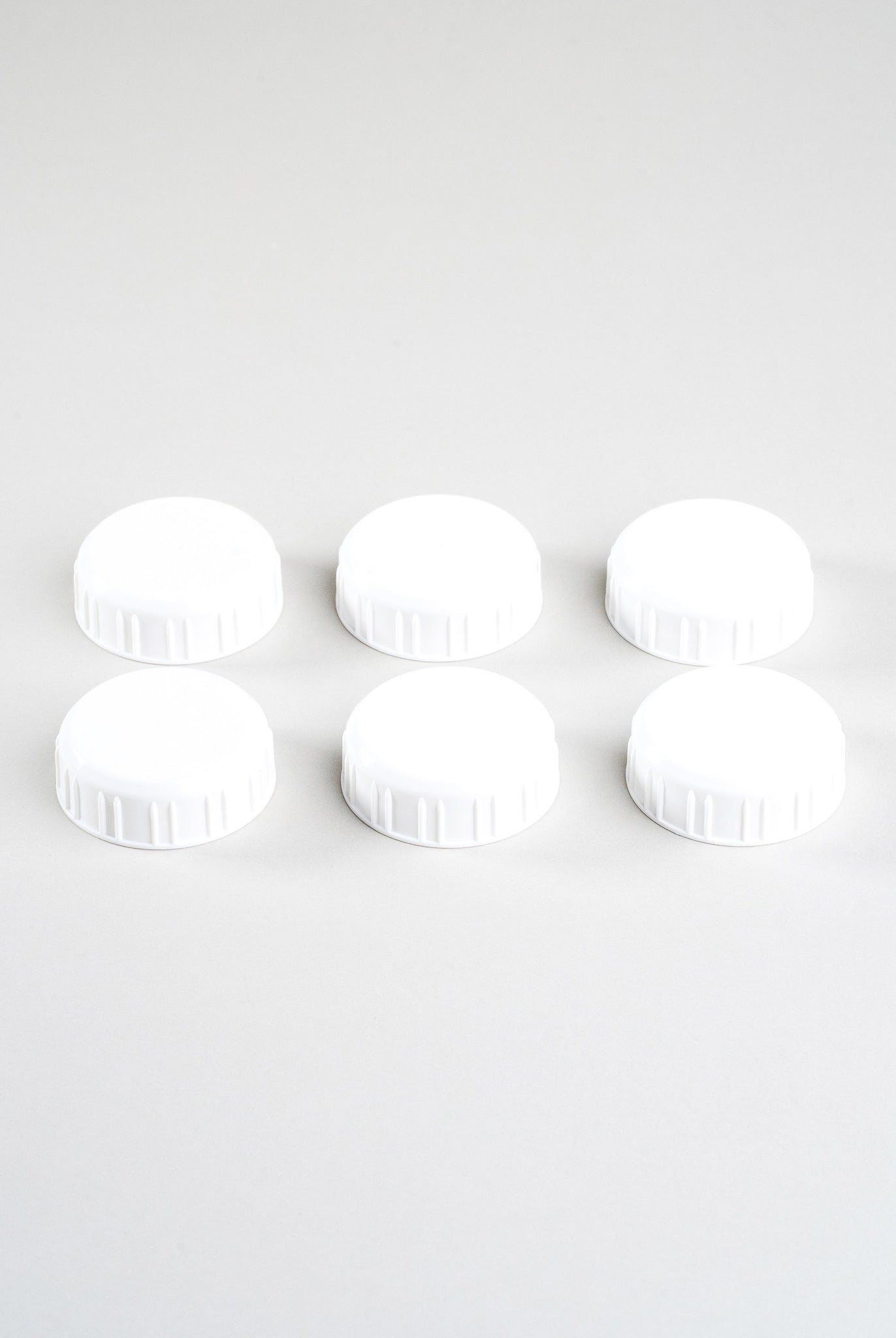 6 white sepal bottle caps