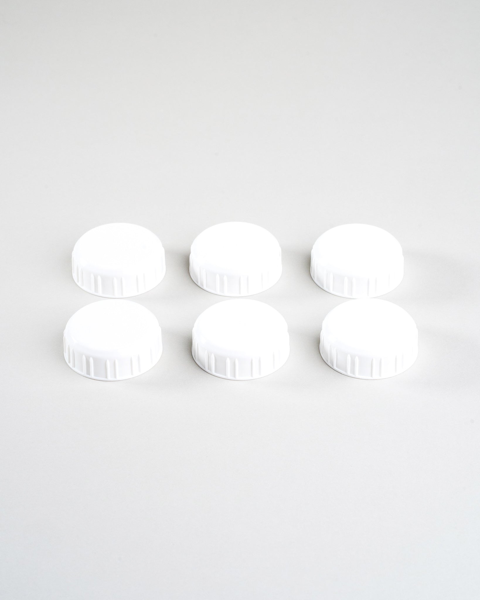 6 white sepal bottle caps