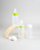 Display of 3 Sepal 150ml bottles, 2 green Sepal Small teat slow flow, 3 Sepal White caps and 1 Sepal clear teat cover. 