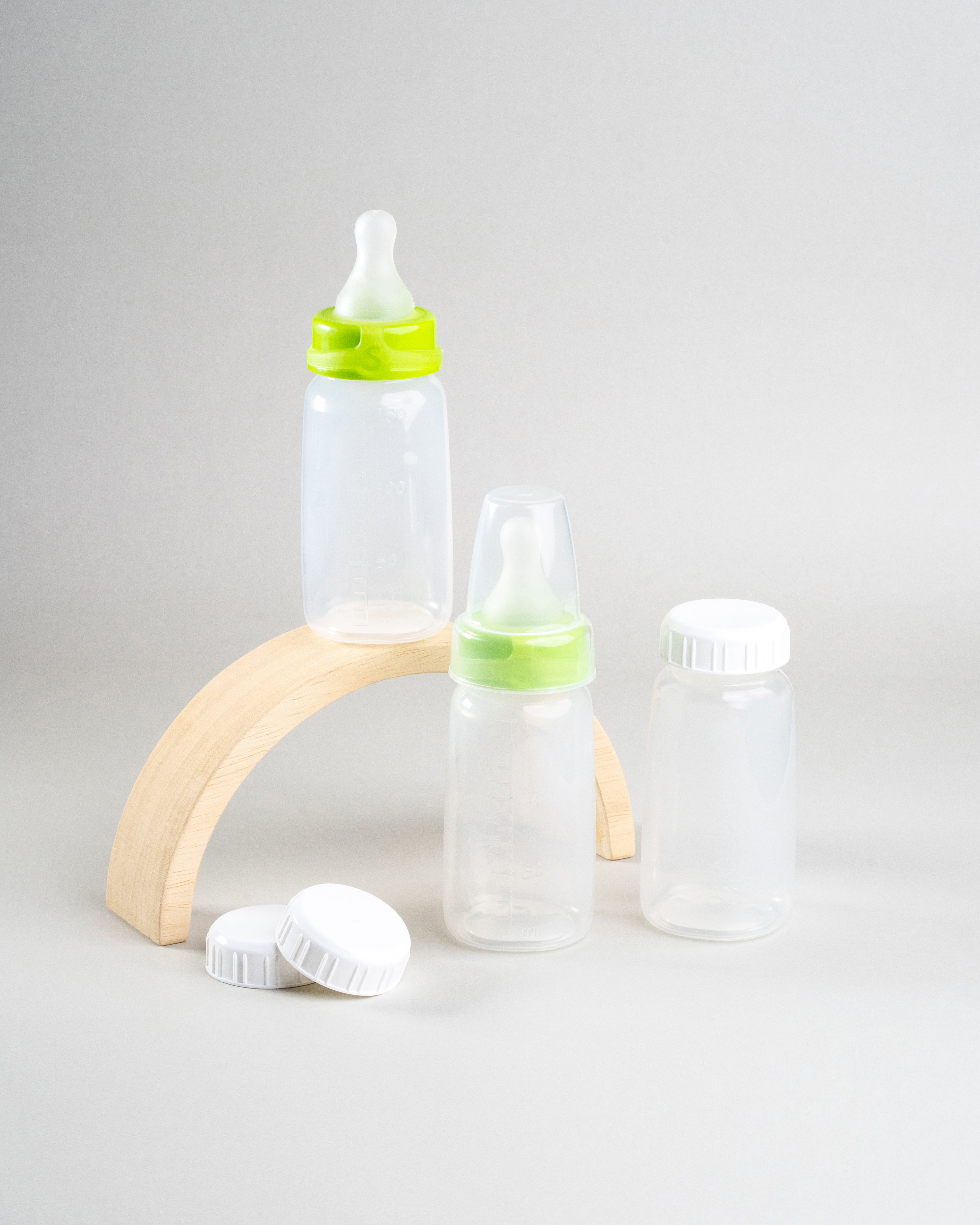 Display of 3 Sepal 150ml bottles, 2 green Sepal Small teat slow flow, 3 Sepal White caps and 1 Sepal clear teat cover. 