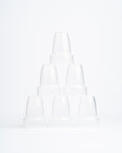 6 clear sepal teat covers stacked in a pyramid